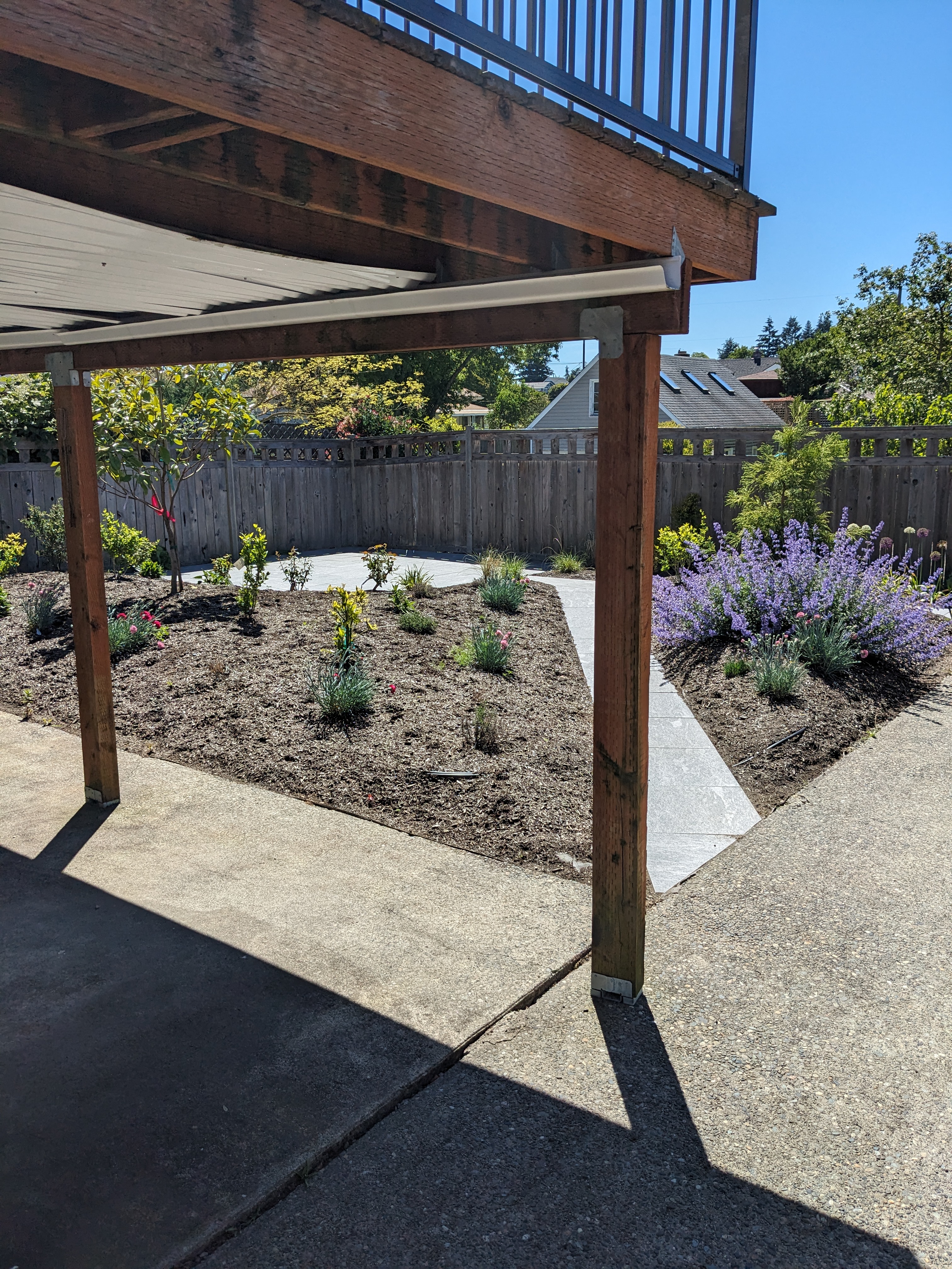 Beautiful backyard garden for peaceful meditation managed by Andrea Martin Homes in Proctor District