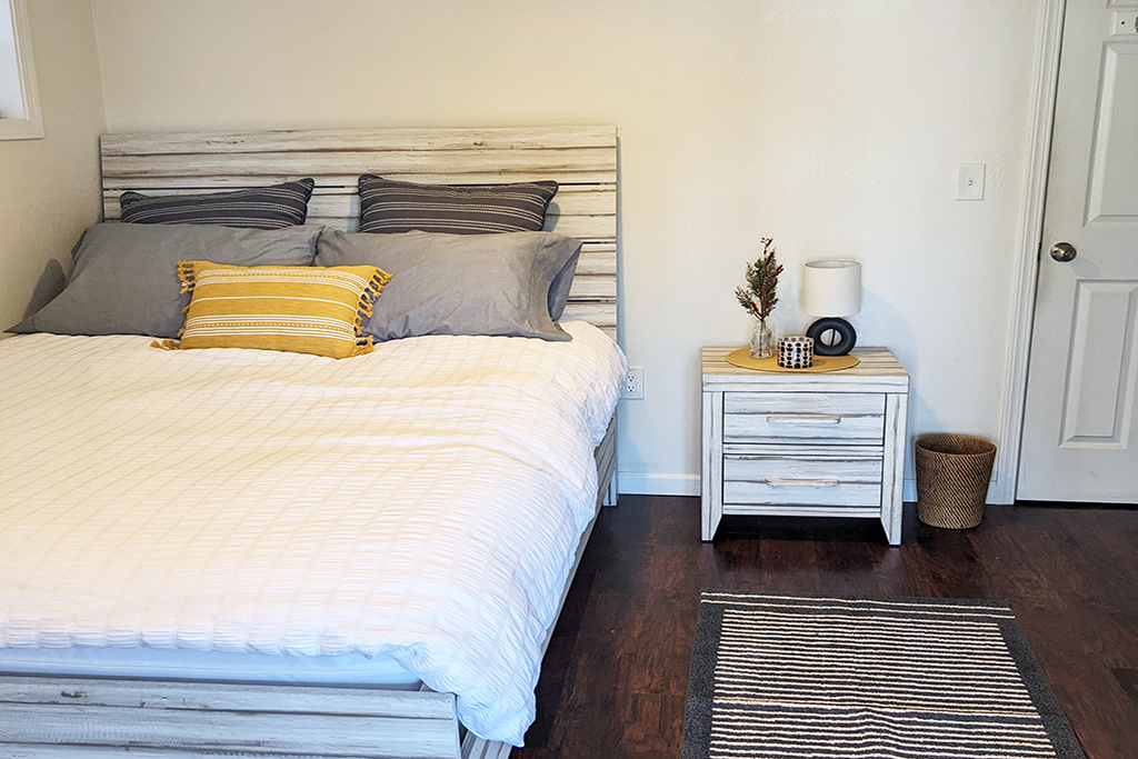 Furnished bedroom in Proctor District, WA managed by Andrea Martin Homes